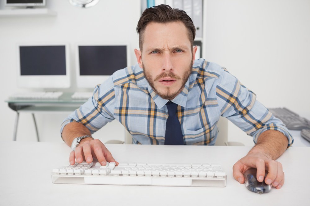 Confused guy stares at computer screen.jpeg