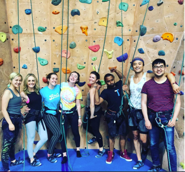 employees rockclimbing together.png
